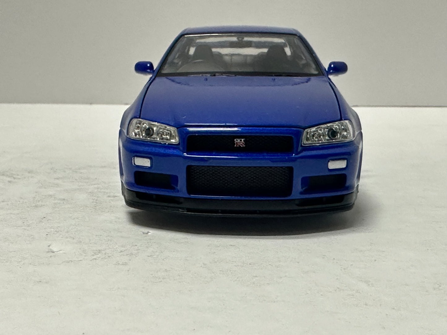 Welly 1:24 NISSAN SKYLINE GT-R (R34) RHD Blue  DIECAST 24108.BU