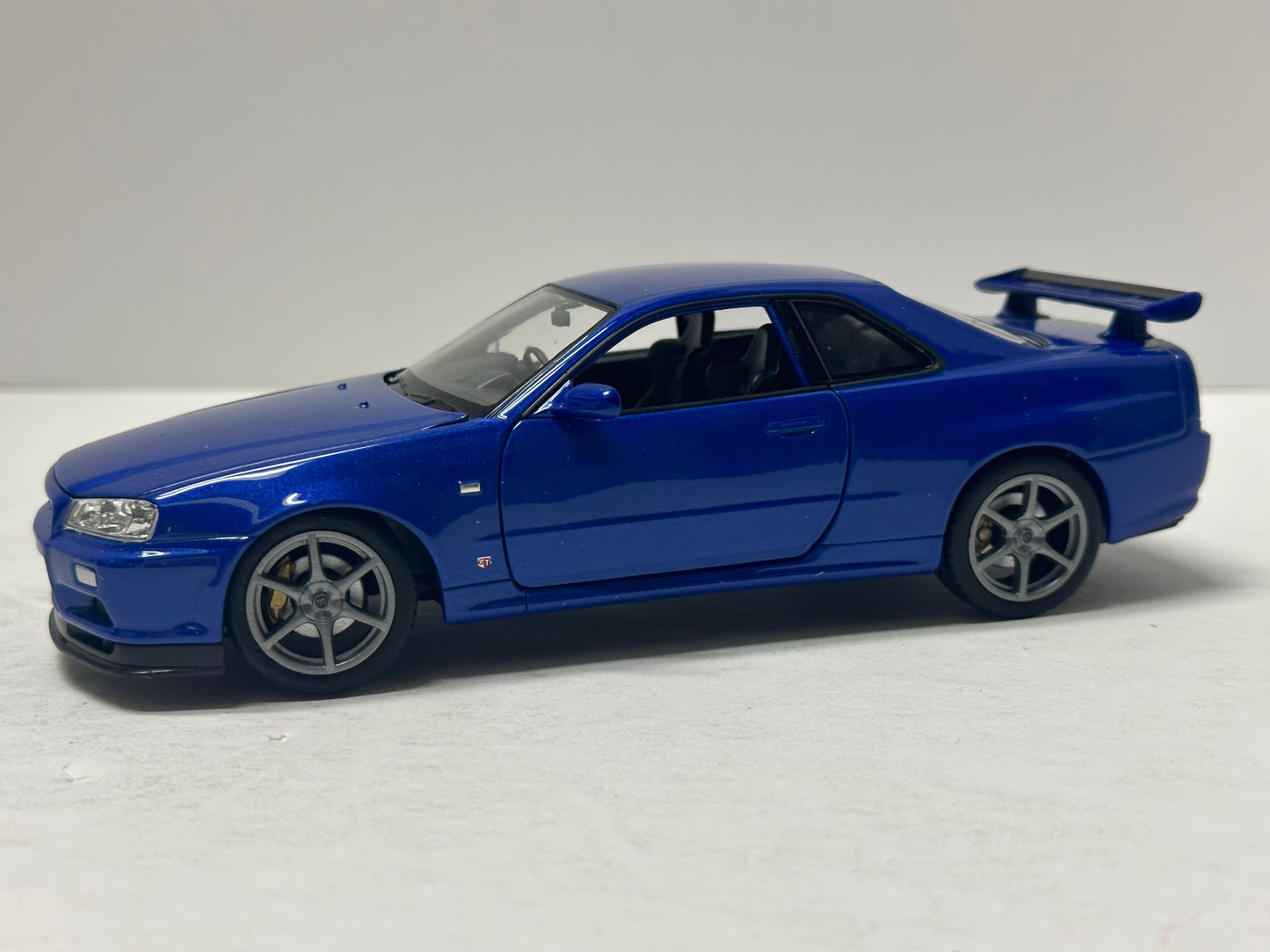 Welly 1:24 NISSAN SKYLINE GT-R (R34) RHD Blue  DIECAST 24108.BU