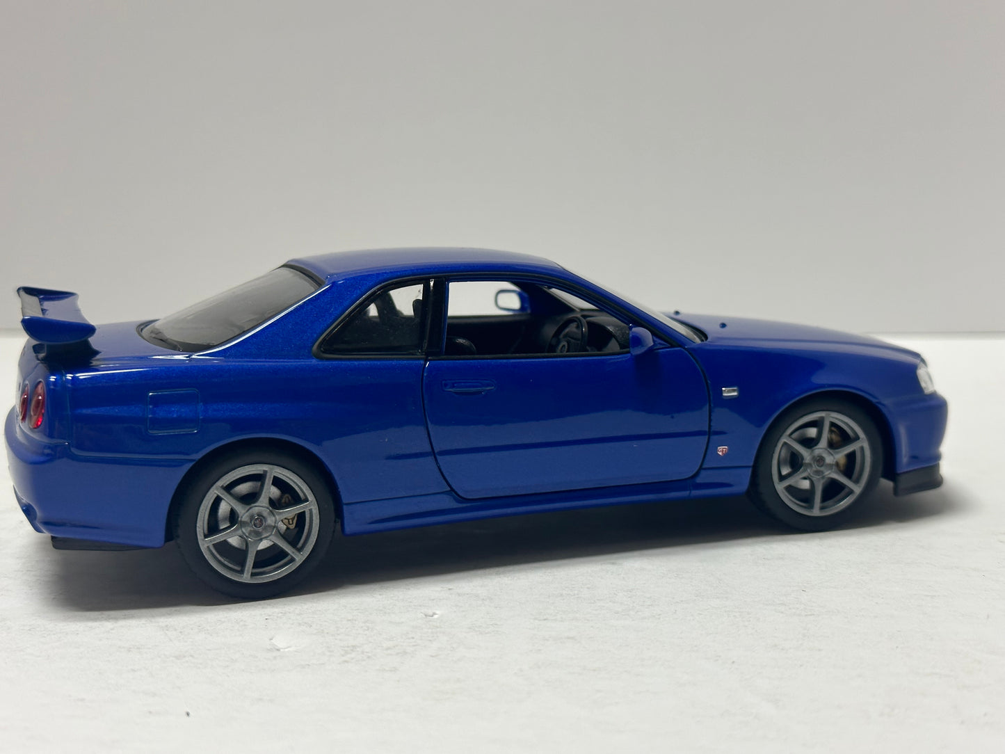 Welly 1:24 NISSAN SKYLINE GT-R (R34) RHD Blue  DIECAST 24108.BU