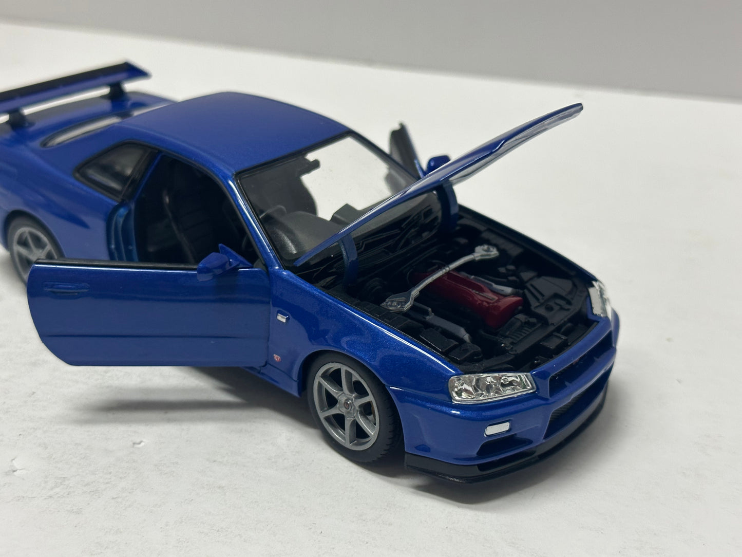 Welly 1:24 NISSAN SKYLINE GT-R (R34) RHD Blue  DIECAST 24108.BU