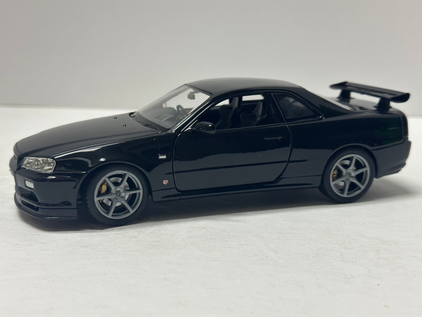 Welly 1:24 NISSAN SKYLINE GT-R (R34) RHD Black DIECAST  24108BK