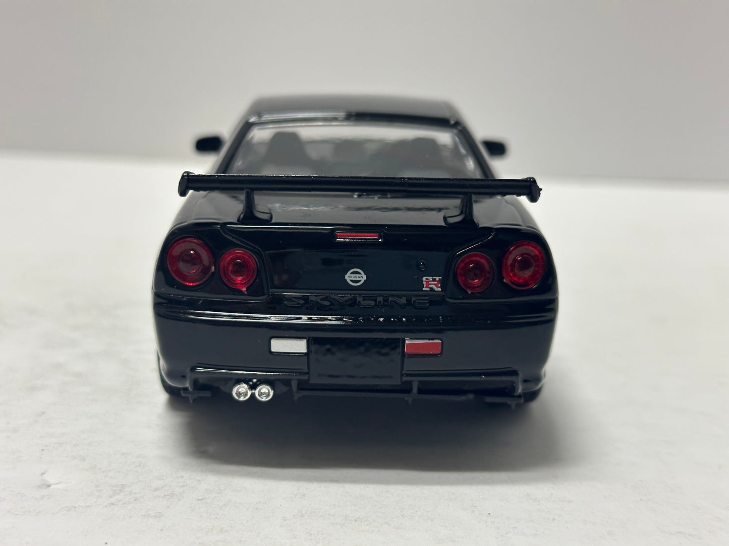 Welly 1:24 NISSAN SKYLINE GT-R (R34) RHD Black DIECAST  24108BK