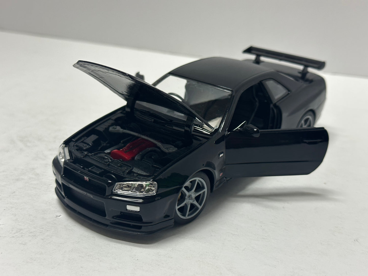 Welly 1:24 NISSAN SKYLINE GT-R (R34) RHD Black DIECAST  24108BK