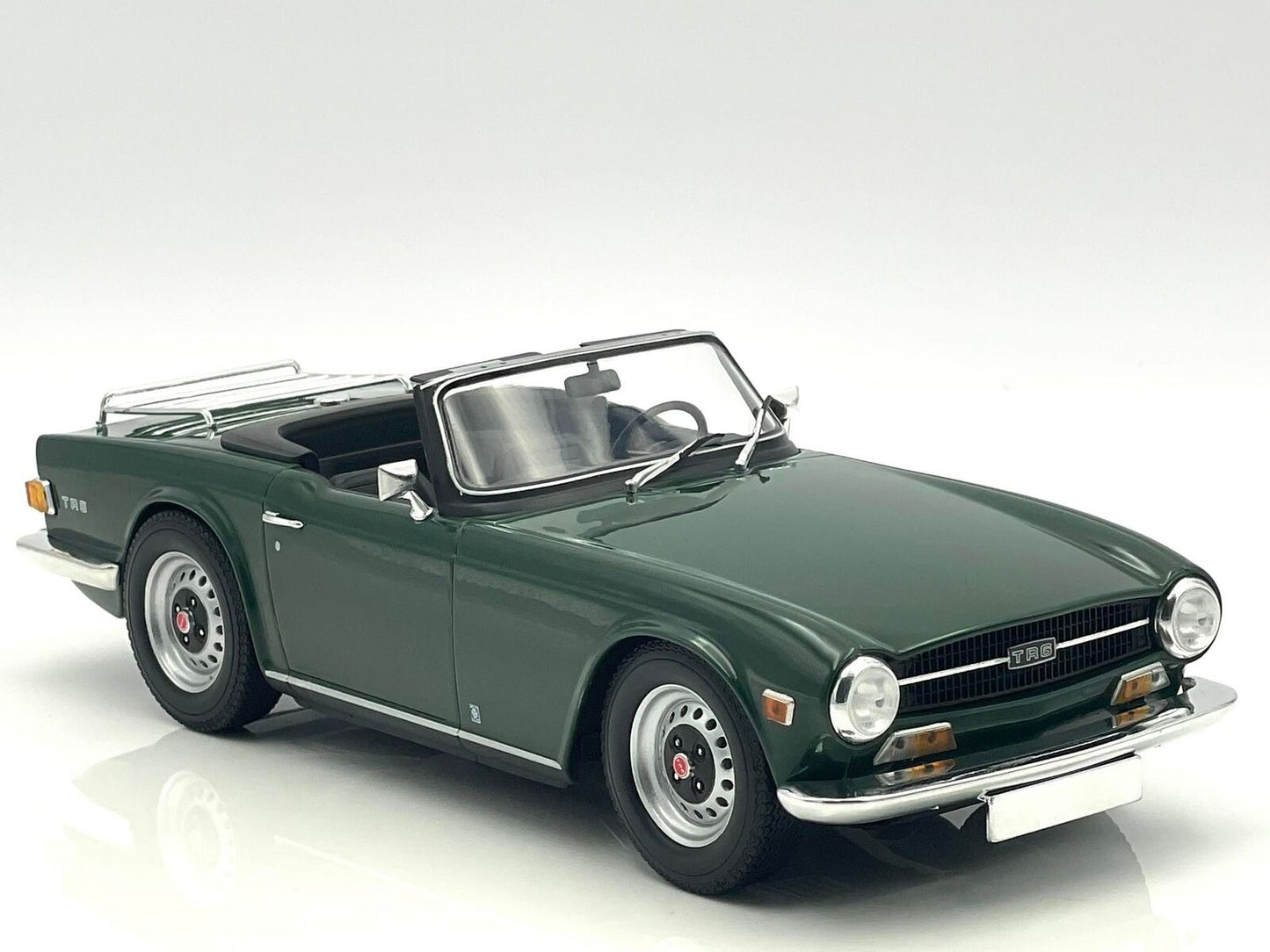 1969 Triumph TR6 LHD Dark Green Top Down in 1:18 scale by Minichamps